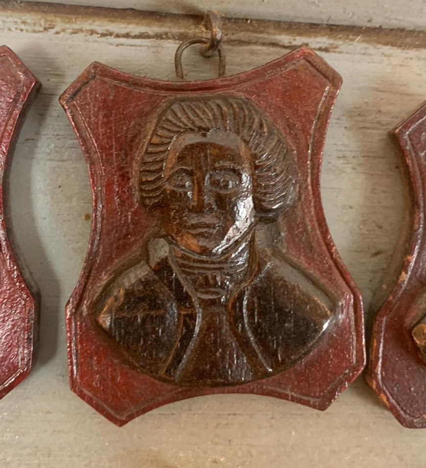 set of 3 frames containing small carved wooden medallions (famous people)