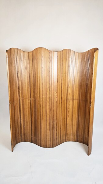 Wavy wooden screen, circa 1950. 
